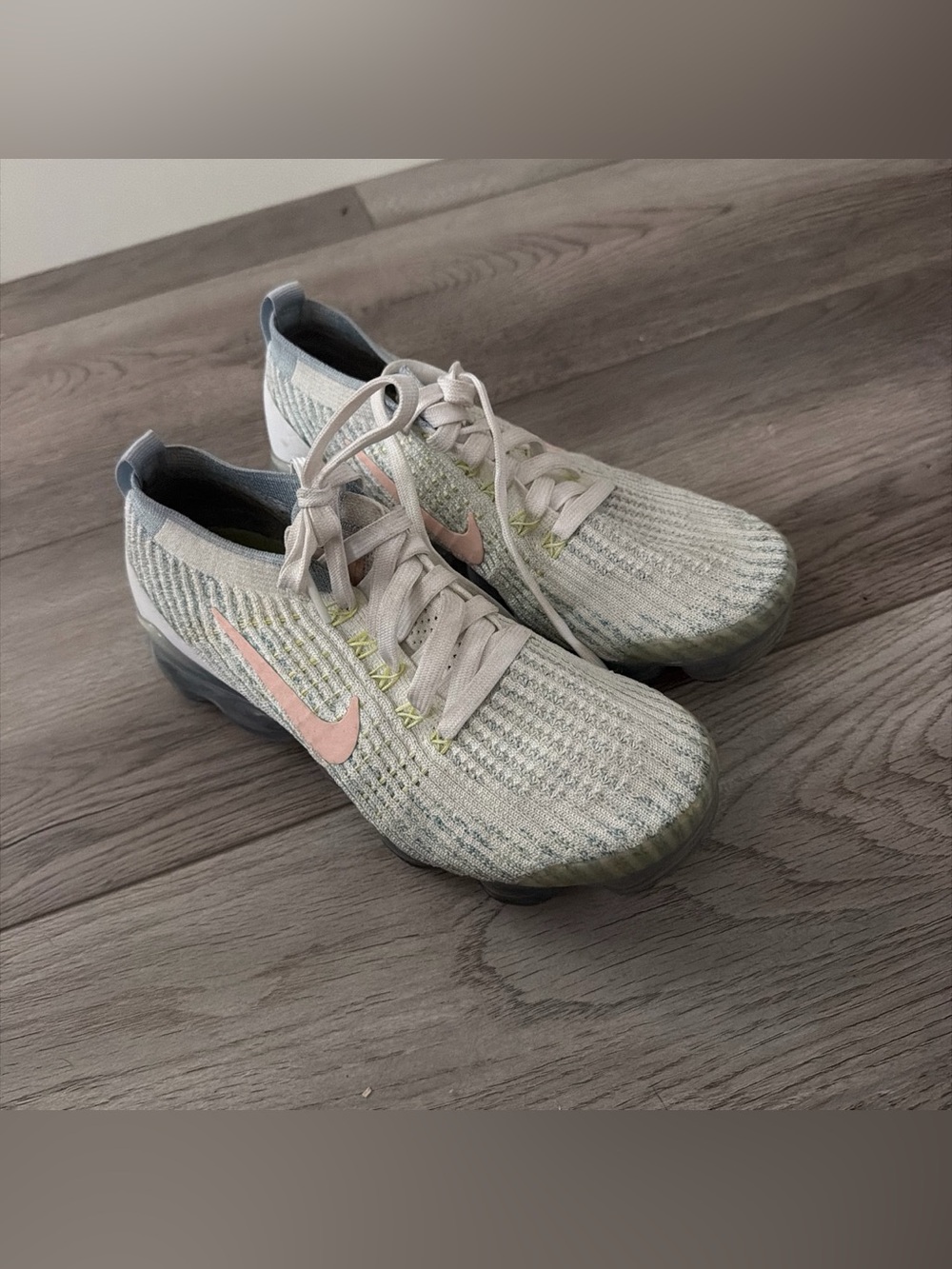Nike Women’s Light Gray Flyknit Sneakers with Pink Swoosh